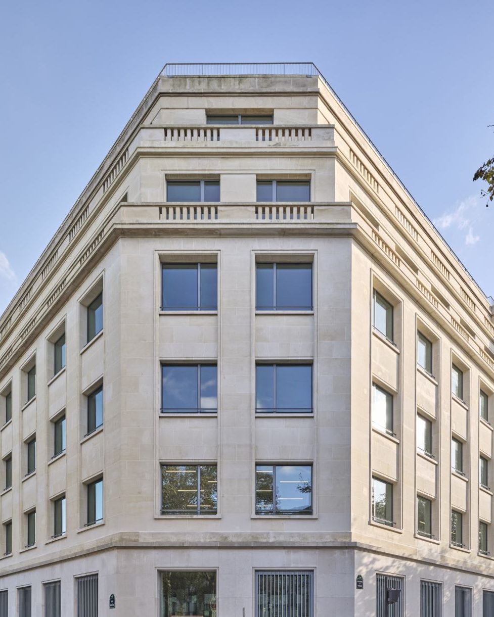 New-build residential stone corner building in Paris